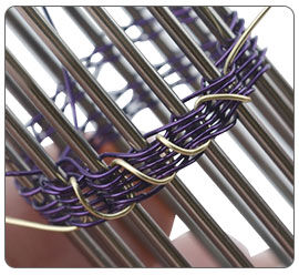 Wire being wrapped around jig pegs